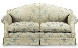 a beige sofa with blue pattern. Brown and Heel upholstery in Northampton on Nosey kitty