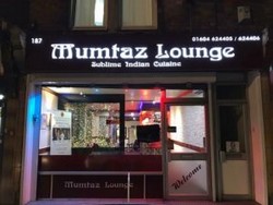 a night time shot of the front of Mumtaz Lounge Indian restaurant in Northampton