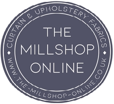 logo for The Mill shop in Northampton. circular logo, grey text on blue background