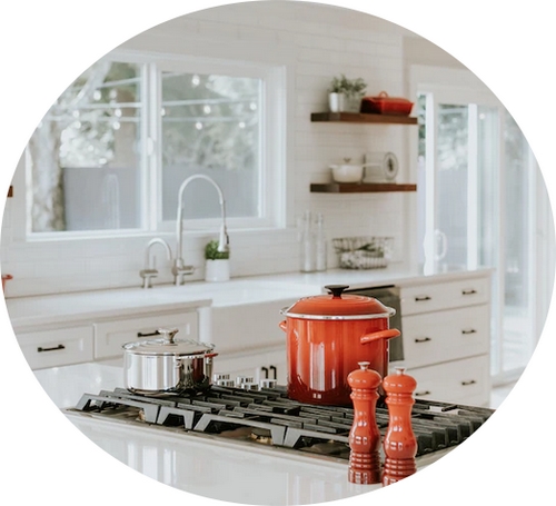 a kitchen with white units