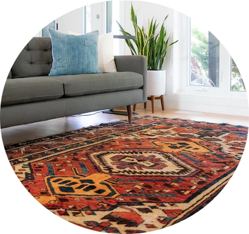 a patterned rug in a room with a sofa