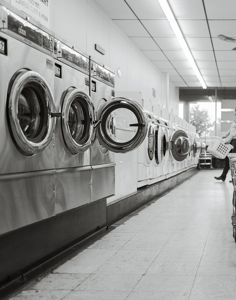 inside a laundrette showing a row of washing machines, Bells laundrette, Kettering road, Northampton