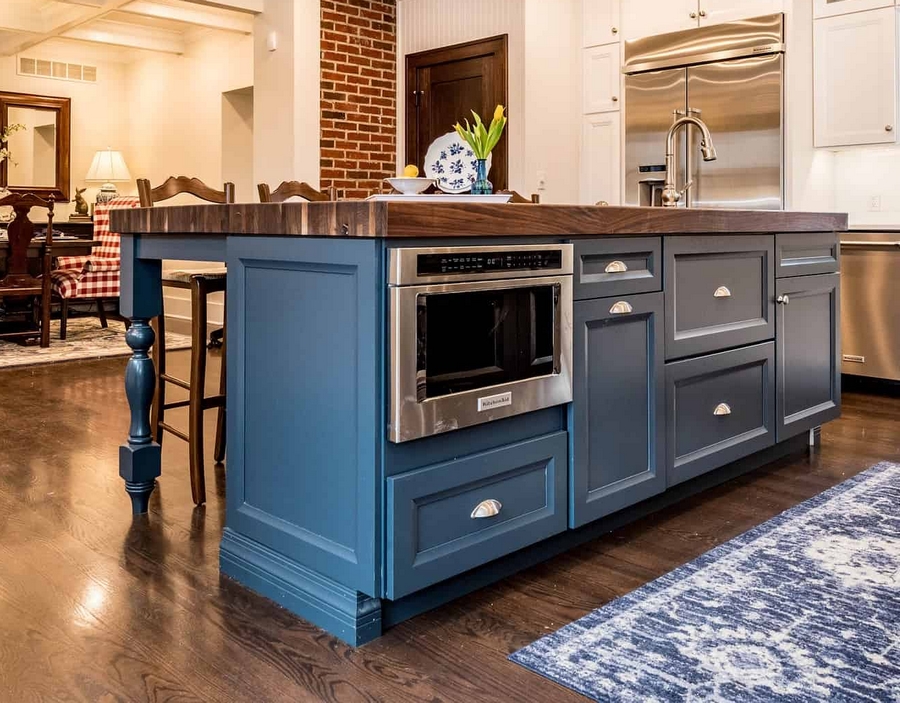 kitchen fitters in Northampton, a blue kitchen island with a built in oven and drawers