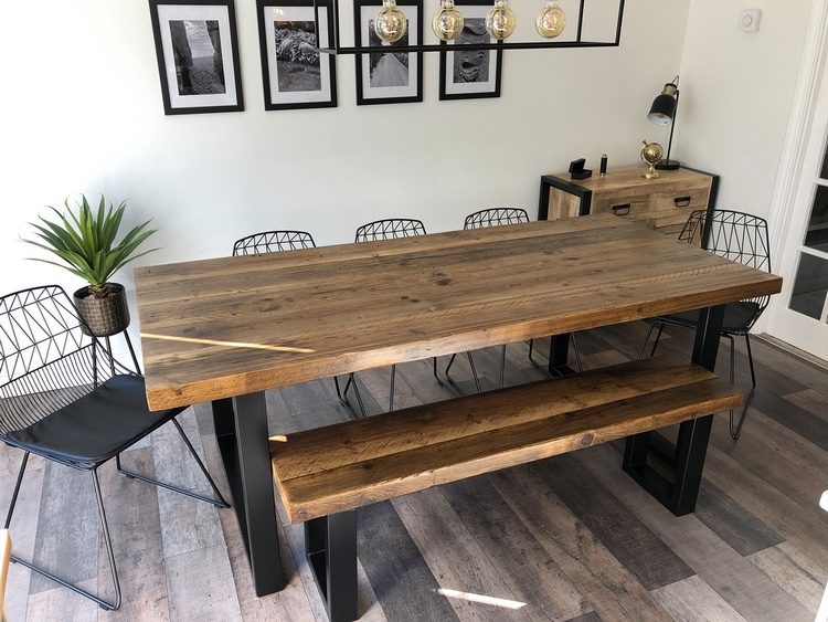 A table and bench with a pine top and metal legs