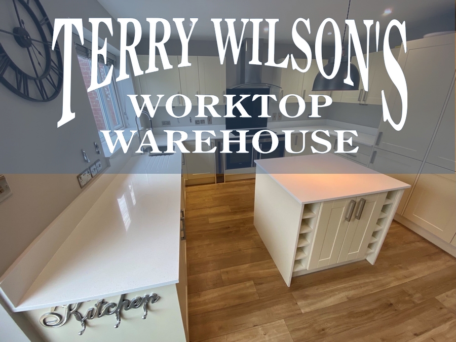 an image of a kitchen with a logo over the top for terry wilsons worktop warehouse. Kitchen worktops in Northampton. 