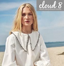 young lady in a linen dress on a sunny beach